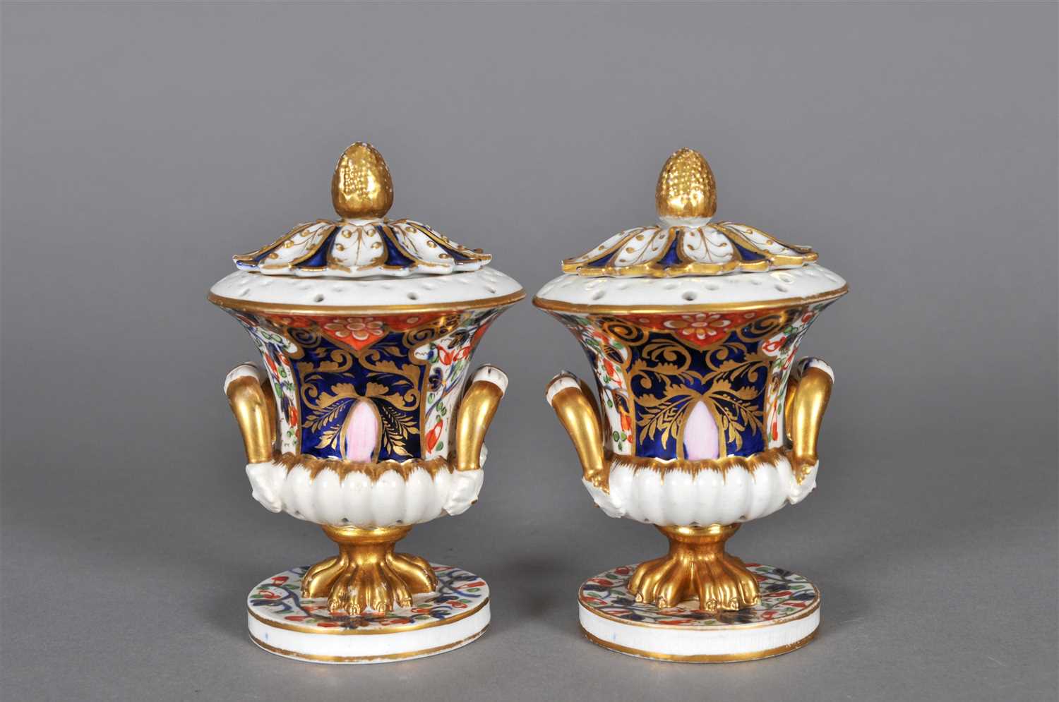 Lot 133 - A pair of Derby pot pourri vases and covers