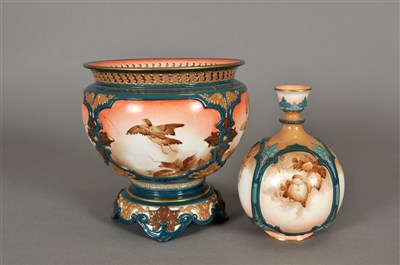 Lot 165 - A Hadley's Worcester jardinière on fixed stand and similar vase