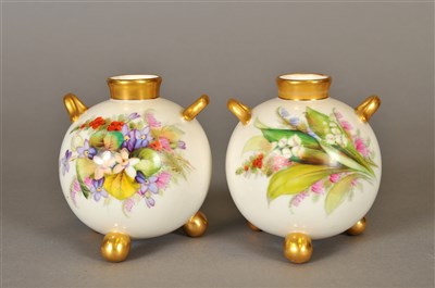 Lot 179 - A pair of Royal Worcester tri-footed vases