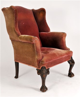 Lot 152 - A 19th century upholstered wing armchair