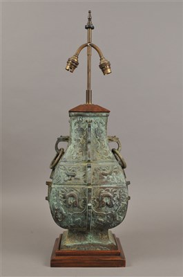 Lot 403 - A Chinese Shang style verdigris patinated bronze table lamp