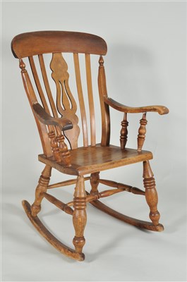 Lot 428 - A 19th century Windsor rocking chair