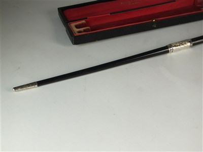 Lot 29 - An early 20th century cased silver mounted conductors baton