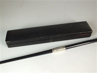 Lot 29 - An early 20th century cased silver mounted conductors baton
