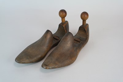 Lot 259 - A pair of hinged treen shoe rests / cobbler's...