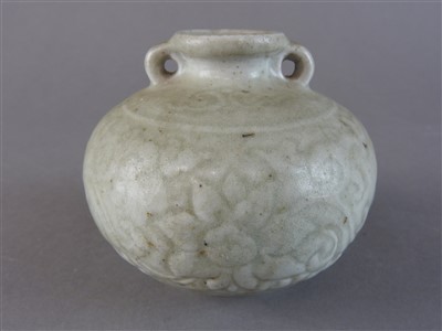 Lot 84 - A Chinese celadon two handled squat globular...