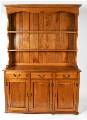 Lot 429 - A reproduction oak dresser with shaped canopy...