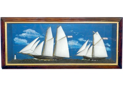 Lot 371 - A late 19th century cased group of two half-hulled gaff rigged boats in full sail