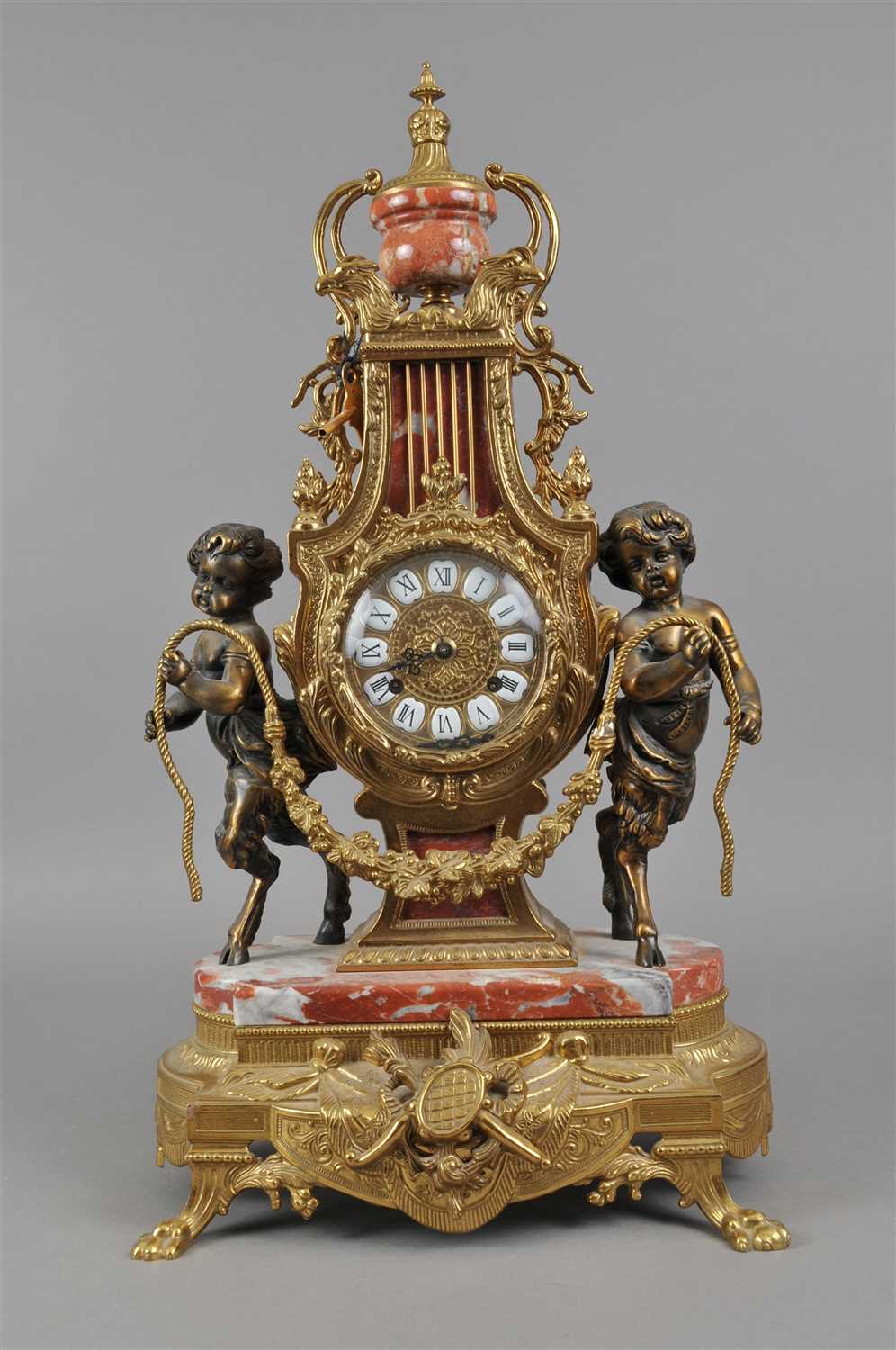 Lot 320 - A gilt metal and marble framed Regency style mantle clock