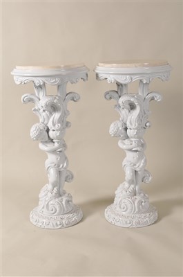 Lot 342 - A decorative pair of stone topped carved figural jardinière stands / pedestals