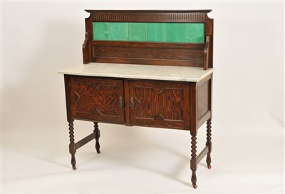 Lot 343 - A marble topped early 20th century oak washstand