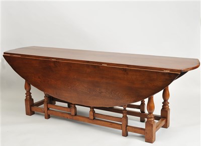 Lot 348 - A large reproduction oak wake table