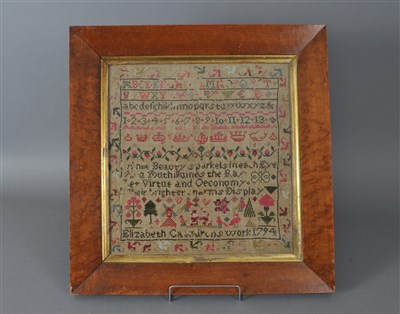 Lot 309 - A George III cross-stitched embroidered alphabetical sampler