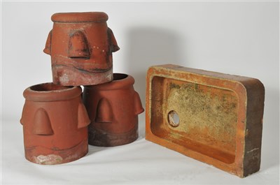 Lot 338 - Three large terracotta garden planters and a  salt glazed sink / planter.