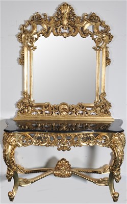 Lot 360 - A decorative composite marble topped reproduction gilded side / pier table