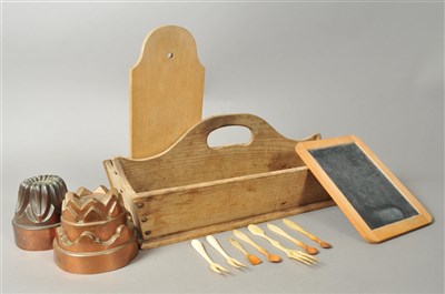 Lot 182 - Two Victorian copper jelly moulds, a stripped oak cutlery tray and a group of bone forks and spoons