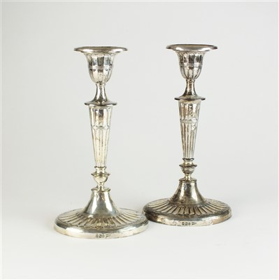 Lot 35 - A pair of silver mounted candlesticks