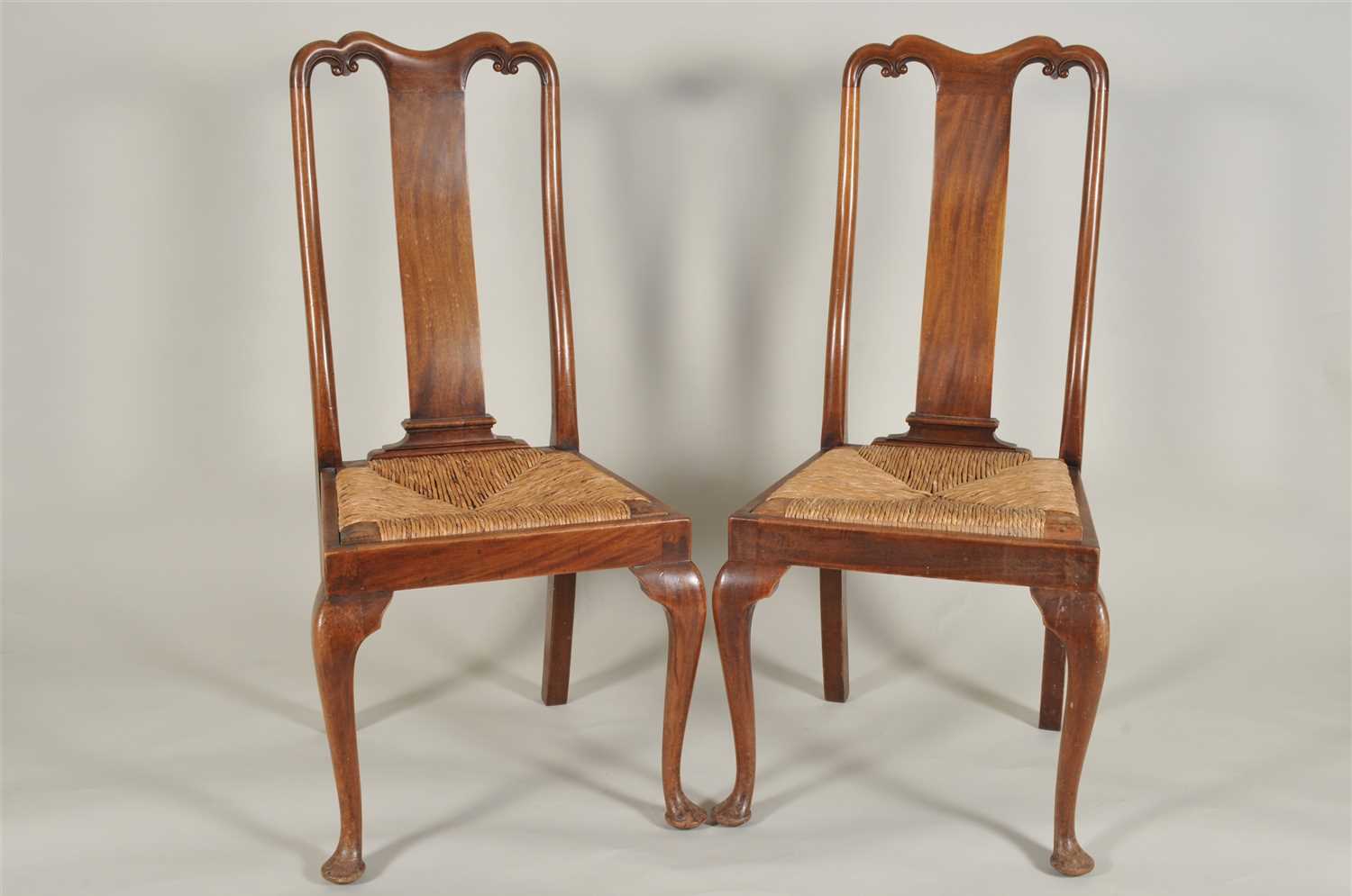 Lot 355 - A set of six Queen Anne style mahogany rush-seated dining chairs