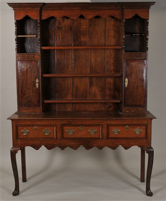 Lot 358 - A George III country oak kitchen dresser