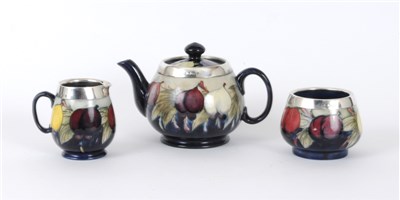 Lot 156 - Moorcroft silver-mounted 'Wisteria' tea service