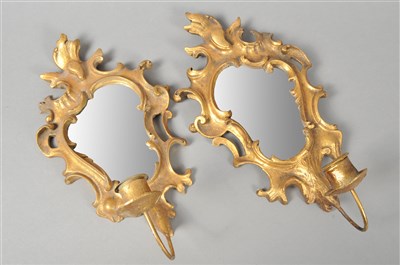 Lot 223 - A decorative pair of 19th century Rococo style gilt mirrored wall sconces