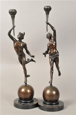 Lot 220 - A pair of 19th century figural bronze candle sticks classically modelled as Mercury and Venus