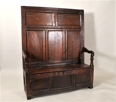 Lot 130 - A George III country oak settle