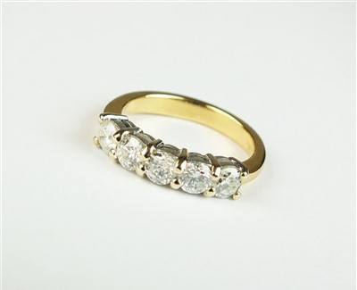 Lot 85 - An 18ct gold five stone diamond ring