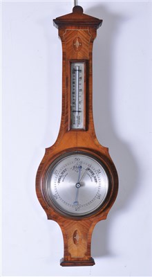 Lot 317 - An Edwardian walnut and mahogany cased wall barometer