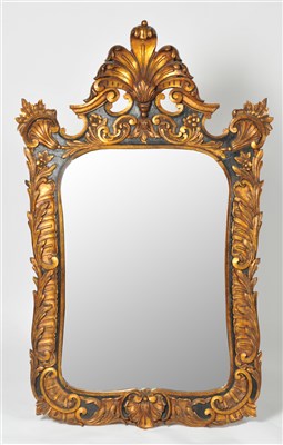 Lot 392 - A decorative Portuguese carved wood and moulded plaster framed wall mirror