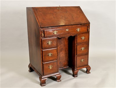 Lot 384 - A small George II and later style cross-banded mahogany veneered bureau