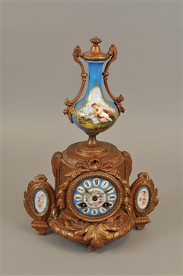 Lot 319 - A late 19th century French cast metal mantle clock