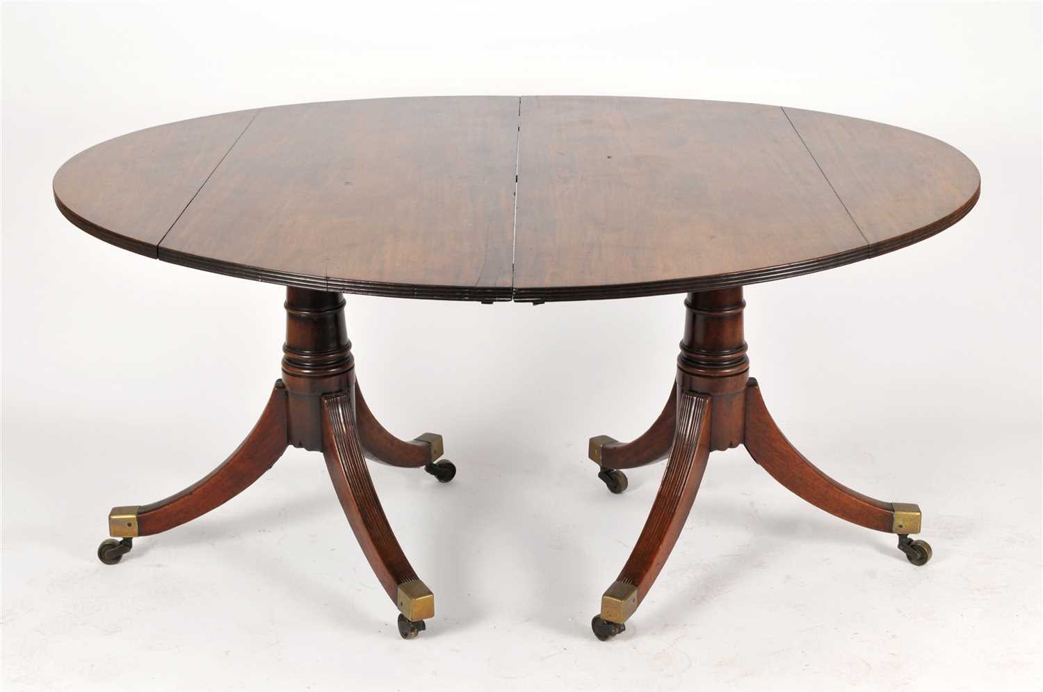 Lot 142 - A large 19th century mahogany twin pedestal dining table