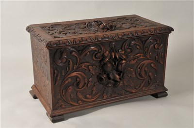 Lot 406 - A 19th century heavily carved continental oak coffer of small proportions