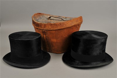 Lot 272 - A 19th century leather lidded hat box accommodating two top hats