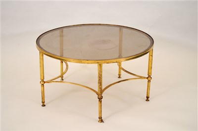 Lot 503 - A mid 20th century glass topped brass framed low occasional / centre table