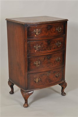 Lot 425 - A small reproduction cross-banded veneered mahogany bow-fronted chest of drawers