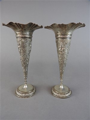 Lot 512 - A pair of white metal vases