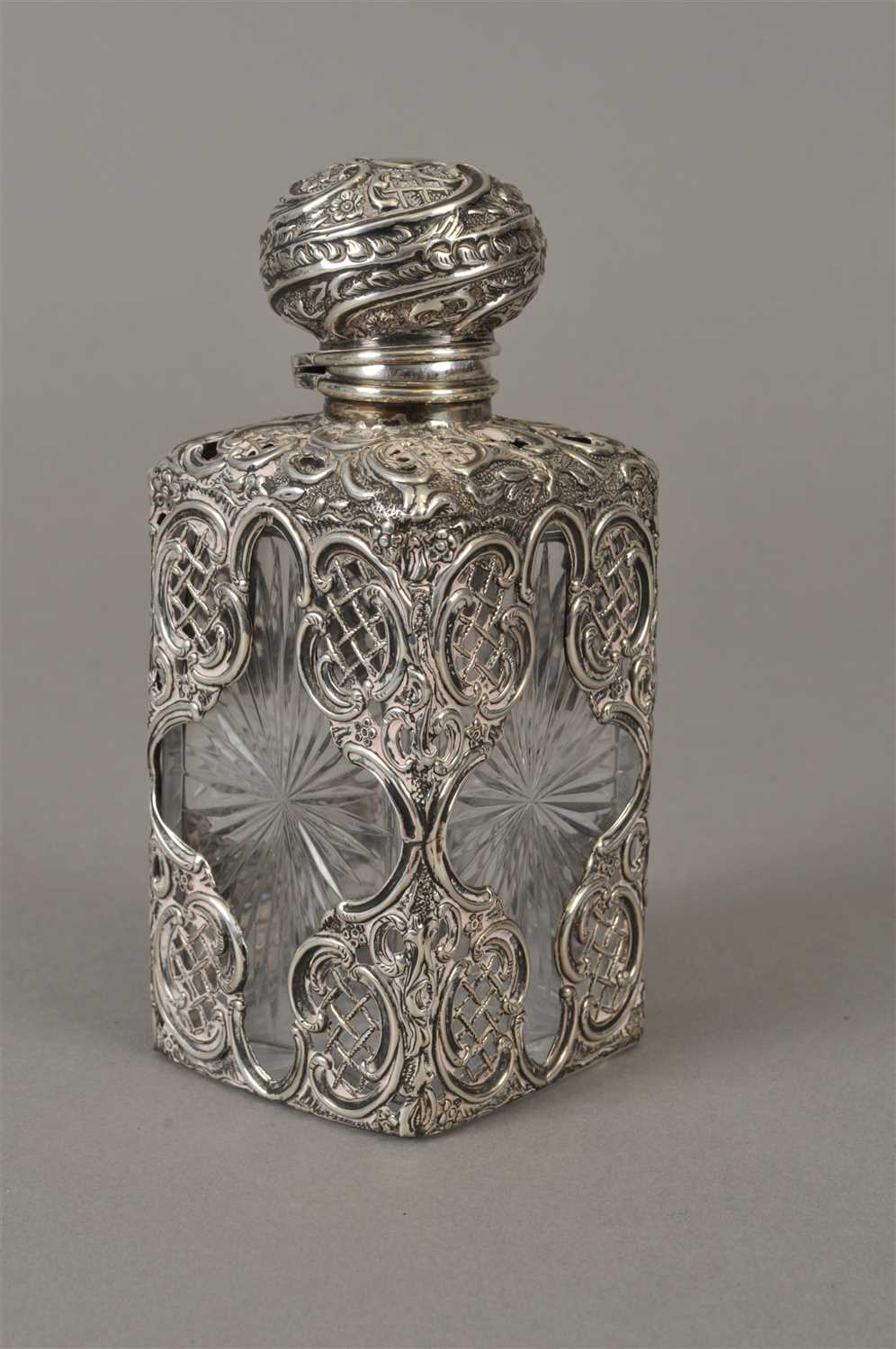 Lot 22 - A silver mounted glass scent bottle