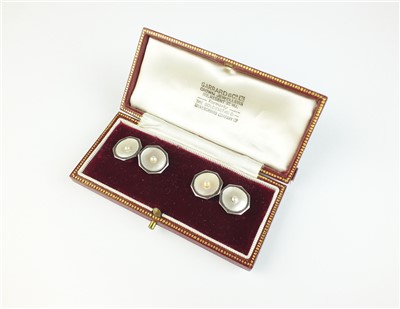 Lot 124 - A pair of mother of pearl and seed pearl cufflinks