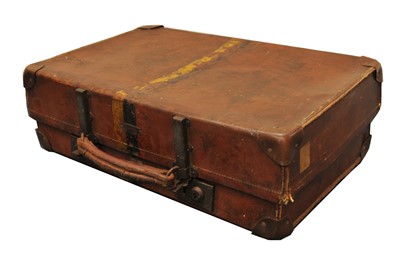 Lot 340 - A collection of six early 20th century stitched tanned leather suitcases