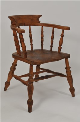 Lot 562 - A stripped oak and ash seated smoker's bow chair