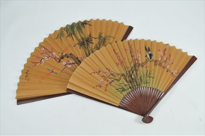 Lot 490 - Two over-sized decorative Chinese wall-hanging painted paper fans