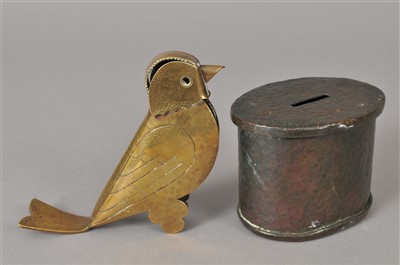 Lot 304 - A planished patinated arts and crafts coin bank and an arts and crafts brass match box cover