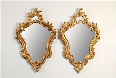 Lot 119 - A pair of late 19th century Rococo style gilt wood frame wall mirrors