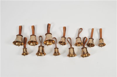 Lot 483 - A graduating collection of twelve bronze hand bells