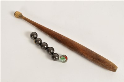 Lot 297 - A 20th century bagatelle board together with pusher and associated balls.