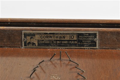 Lot 297 - A 20th century bagatelle board together with pusher and associated balls.