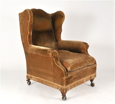 Lot 143 - A 19th century upholstered wing arm chair