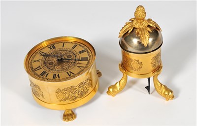 Lot 158 - A reproduction brass table clock by Sinclair Harding